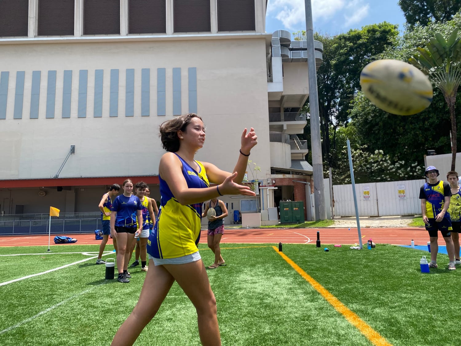 A Centaurs Touch player watches the ball into her hands to take a pass on the move